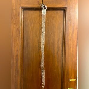 Plastic belt with metal cutouts